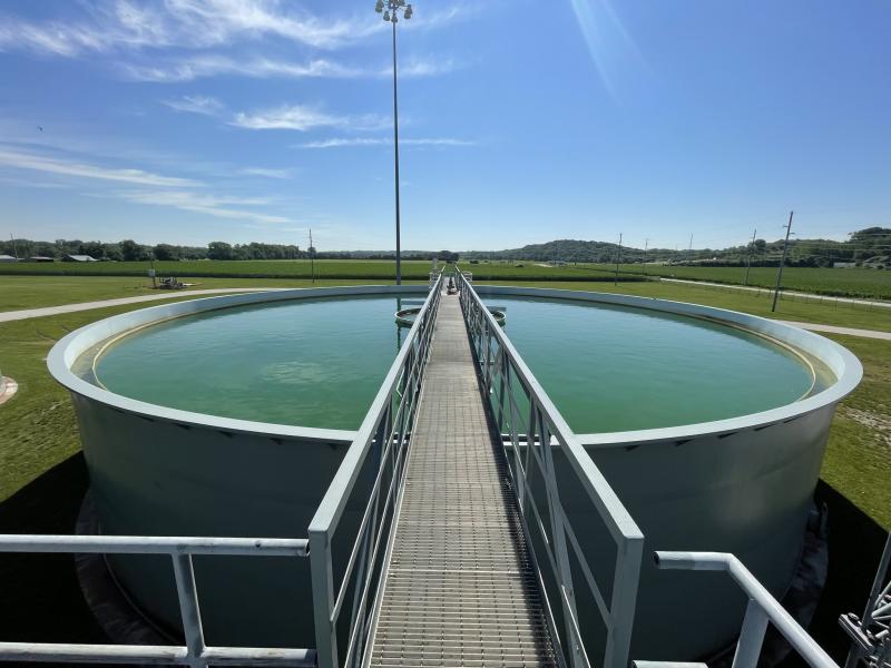 Blue green water shines on a sunny day in a water treatment basin at the Courtney Bend Water Treatment Plant in northeast Independence. 