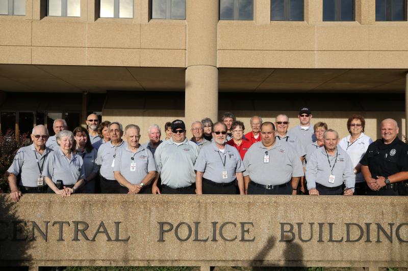 Group of volunteers in front of the Police Building